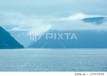 Fjord summer cloudy view (Norway) 12433640