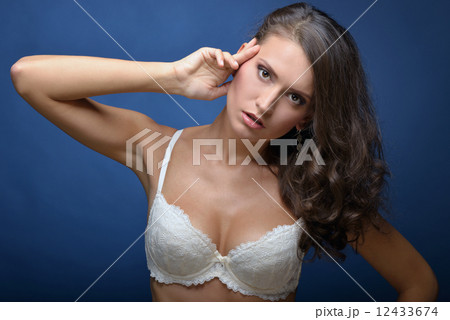 Beautiful woman with long hair in white lace underwear. 12433674