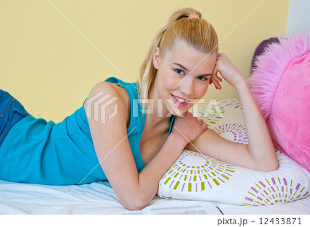 teen girl smiling in her bed teen girl smiling in her bed 12433871