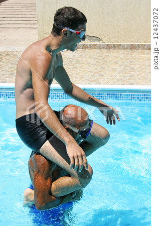 Men in swimming pool 12437072