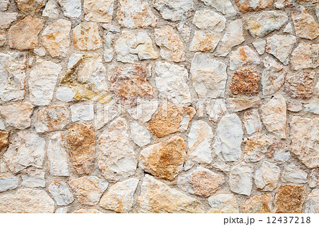 Background photo texture of yellow gray stone wall 12437218