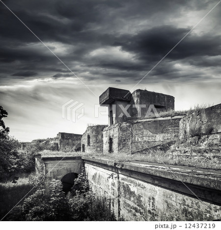 Old bunker from WWII period. Monochrome photo Old bunker from WWII period. Monochrome photo 12437219
