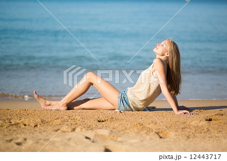 Beautiful woman relaxing on the beach 12443717