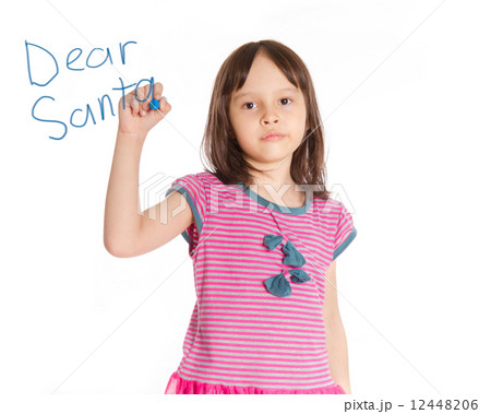 Young girl writing to Santa on imaginary board 12448206