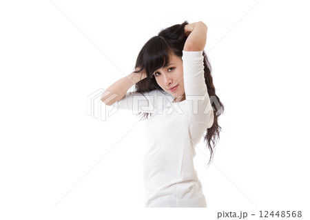 Chinese female with hands in hair 12448568