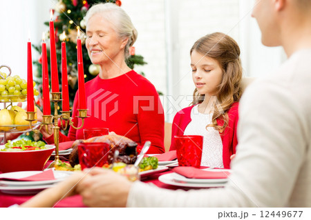 smiling family having holiday dinner at home smiling family having holiday dinner at home 12449677