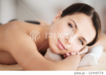 beautiful woman in spa salon with hot stones 12449779