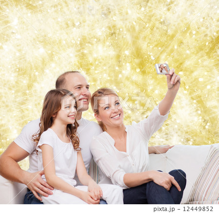 happy family with camera at home happy family with camera at home 12449852