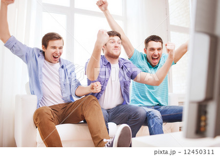 happy male friends at home 12450311
