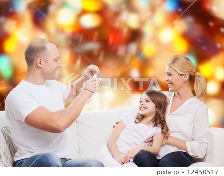 happy family with camera at home 12450517