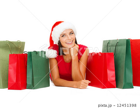 woman in red shirt with shopping bags 12451398