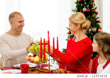 smiling family having holiday dinner at home smiling family having holiday dinner at home 12451616