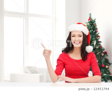 smiling woman in santa helper hat smiling woman in santa helper hat 12451744