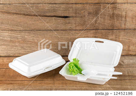 foam boxes with scraps left over from eating 12452196