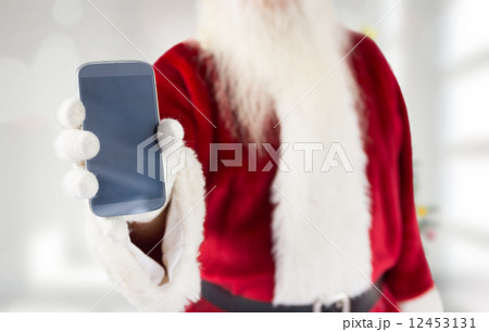 Composite image of santa claus showing smartphone 12453131