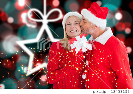 Composite image of festive couple 12453132