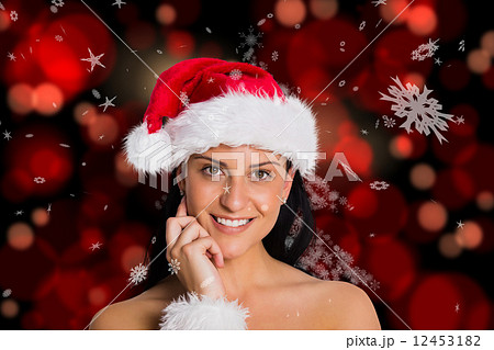 Composite image of woman smiling at the camera 12453182