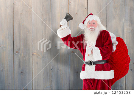 Composite image of santa claus ringing bell Composite image of santa claus ringing bell 12453258