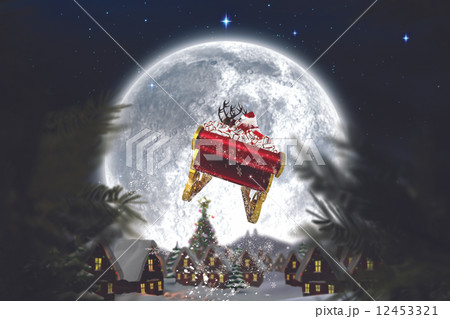 Composite image of santa flying his sleigh Composite image of santa flying his sleigh 12453321