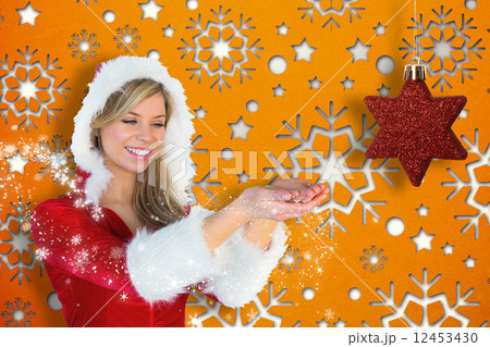 Pretty santa girl holding hands out Pretty santa girl holding hands out 12453430