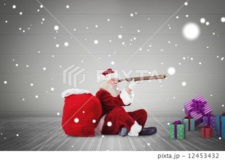 Composite image of santa looking through telescope Composite image of santa looking through telescope 12453432
