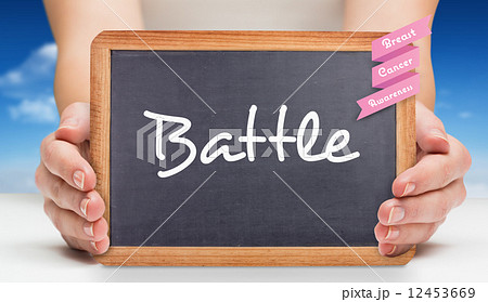 Composite image of females hands showing black board 12453669