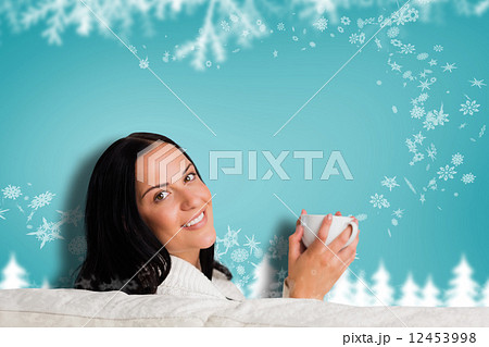 Composite image of woman enjoying a lovely drink Composite image of woman enjoying a lovely drink 12453998