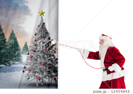 Composite image of santa pulls something with a rope 12454043