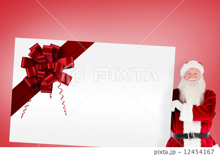 Santa claus showing card with ribbon 12454167