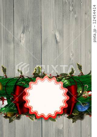 Composite image of fir branch christmas decoration garland Composite image of fir branch christmas decoration garland 12454414