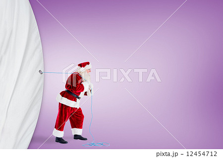 Santa claus pulling a rope Santa claus pulling a rope 12454712