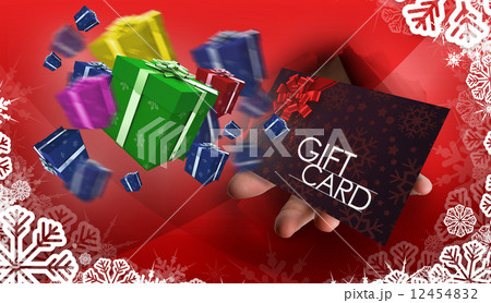 Composite image of hand bursting through paper 12454832