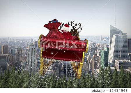 Composite image of santa flying his sleigh Composite image of santa flying his sleigh 12454943