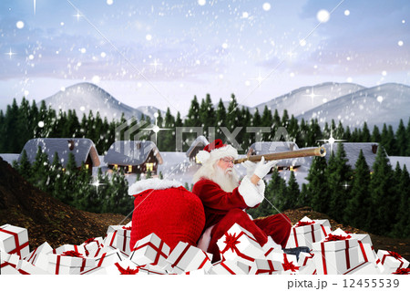 Composite image of santa looking through a telescope Composite image of santa looking through a telescope 12455539