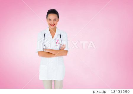 Composite image of pretty nurse with arms crossed Composite image of pretty nurse with arms crossed 12455590