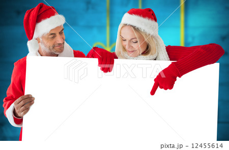 Composite image of festive couple 12455614
