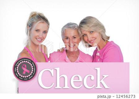 Composite image of happy women wearing pink tops and ribbons for 12456273