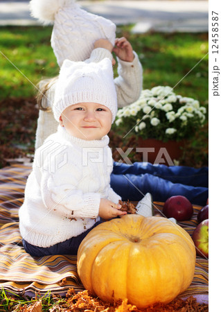 Baby boy with sister in autumn park Baby boy with sister in autumn park 12458587