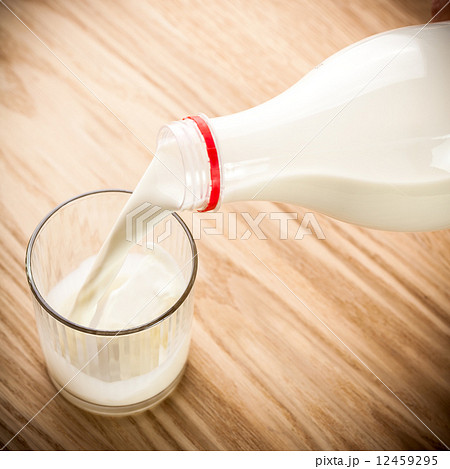 Milk poured from bottle Milk poured from bottle 12459295