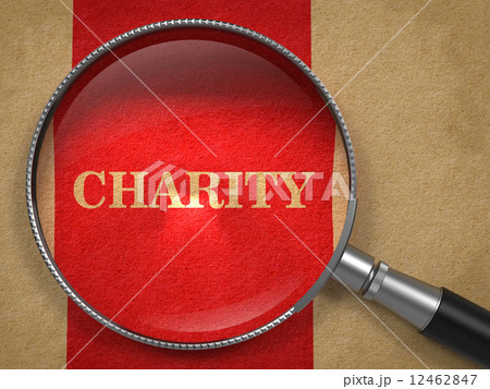 Charity through Magnifying Glass on Old Paper. 12462847