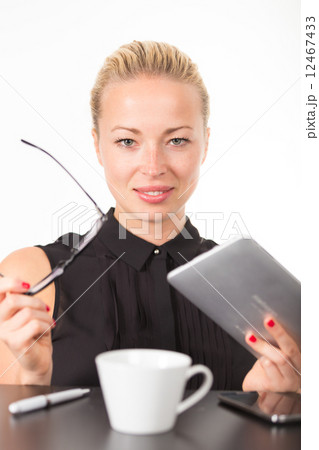 Business woman working on tablet PC. 12467433