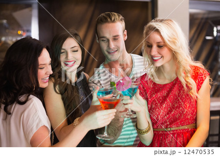 Young friends having a drink together 12470535