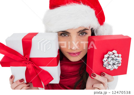Pretty brunette showing christmas gifts Pretty brunette showing christmas gifts 12470538