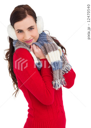Pretty brunette in winter wear smiling at camera Pretty brunette in winter wear smiling at camera 12470540