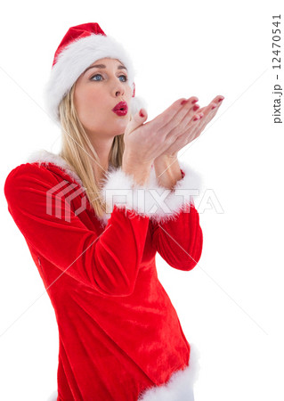 Festive blonde blowing over hands Festive blonde blowing over hands 12470541