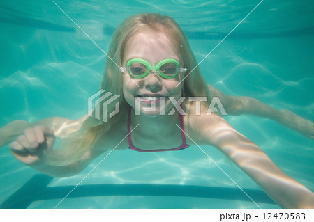 Cute kid posing underwater in pool 12470583