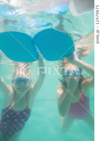 Cute kids posing underwater in pool 12470675