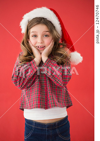 Festive little girl smiling at camera Festive little girl smiling at camera 12470746