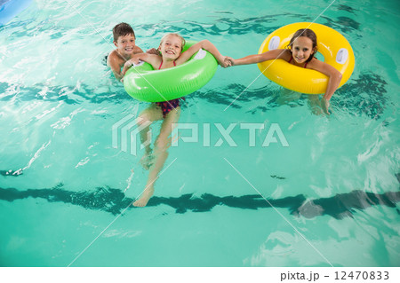 Cute little kids in the swimming pool 12470833