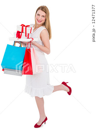 Elegant blonde with shopping bags and gifts Elegant blonde with shopping bags and gifts 12471377